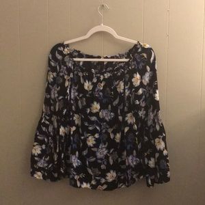 Black blouse with a blue and white floral pattern